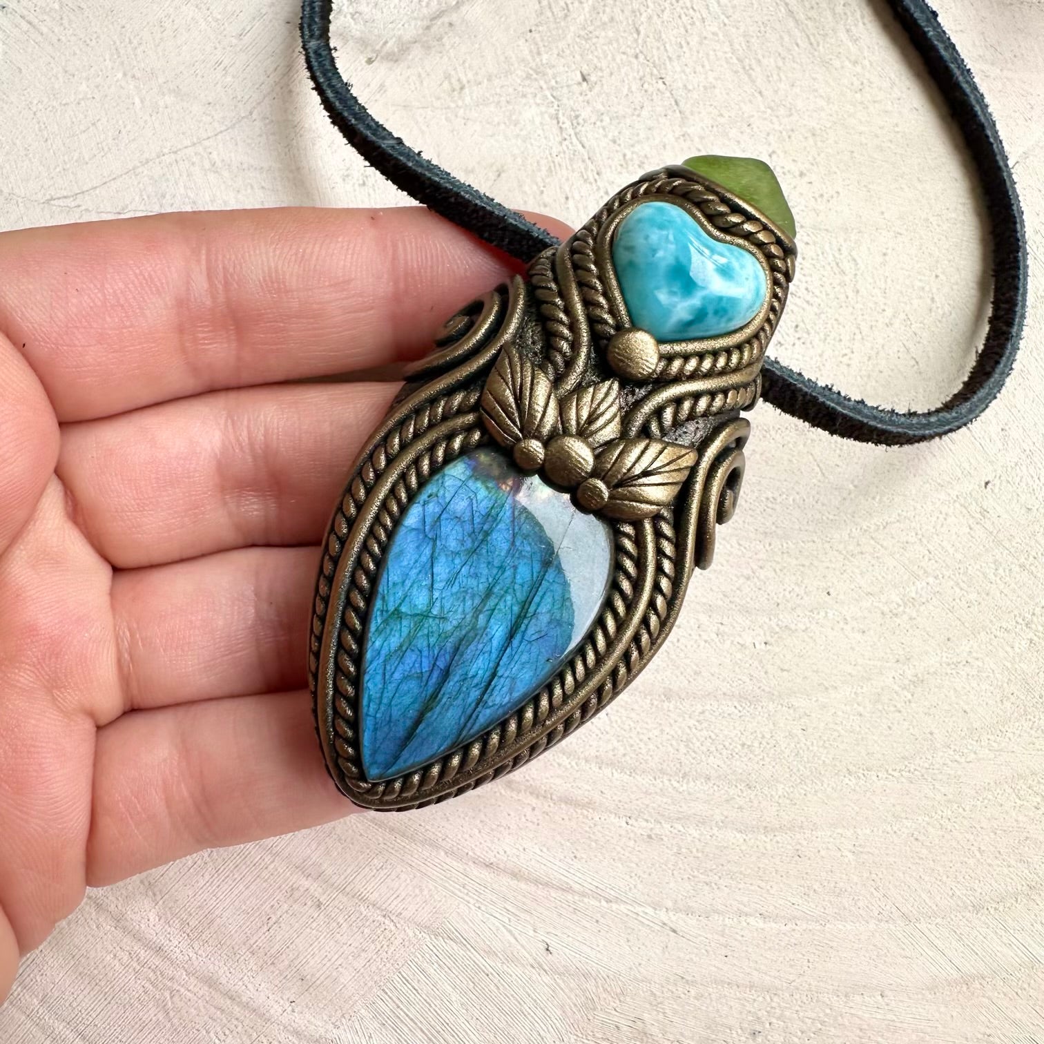 Healing stone necklace with labradorite, larimar heart, and peridot crystals for positive energy