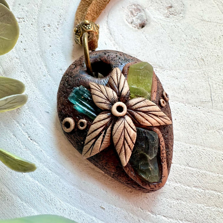 Boho crystal necklace with Moldavite and green gemstones for spiritual jewelry lovers