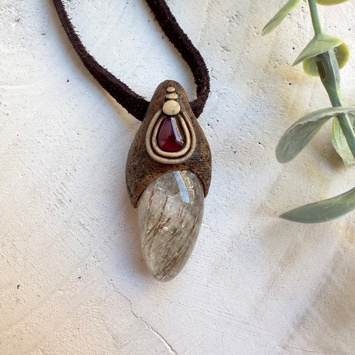 Grounding energy necklace featuring hematite in quartz and quartz crystal