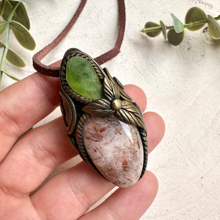 Handmade Hematite Quartz and Peridot healing crystal necklace with spiritual gemstone pendant for grounding and positivity.