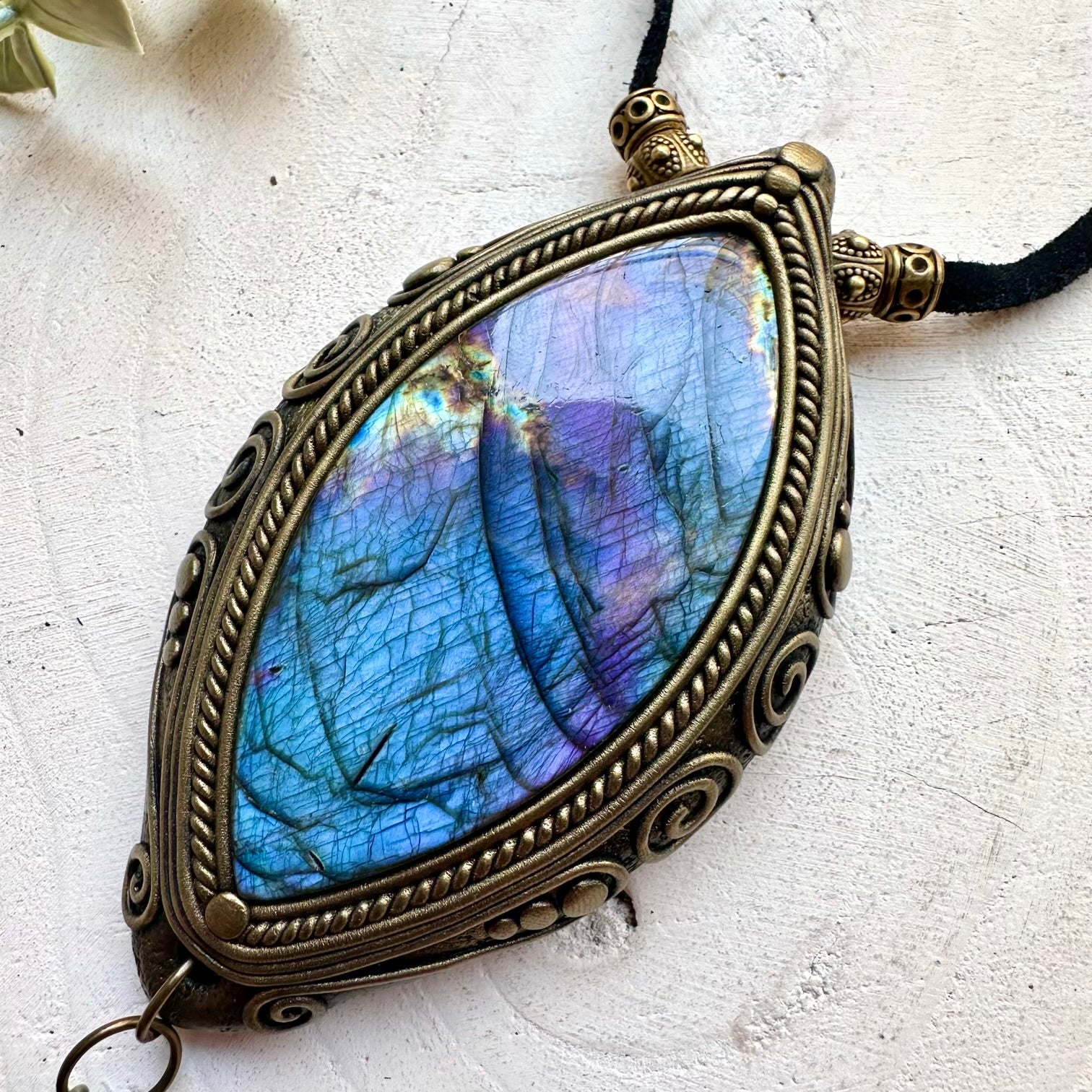 Handmade healing crystal necklace with a large Labradorite, Amethyst and Boulder Opal in an artisan clay setting design.