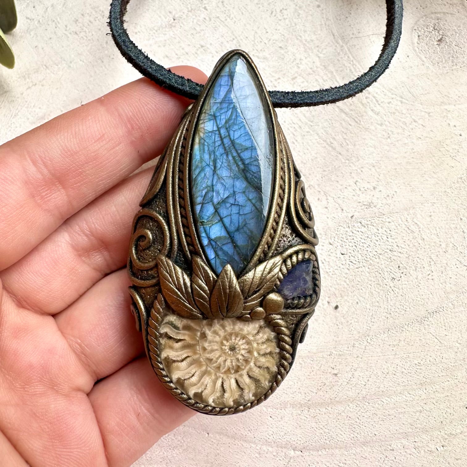 Handmade Labradorite necklace with Ammonite fossil and Tanzanite pendant for spiritual healing and protection.