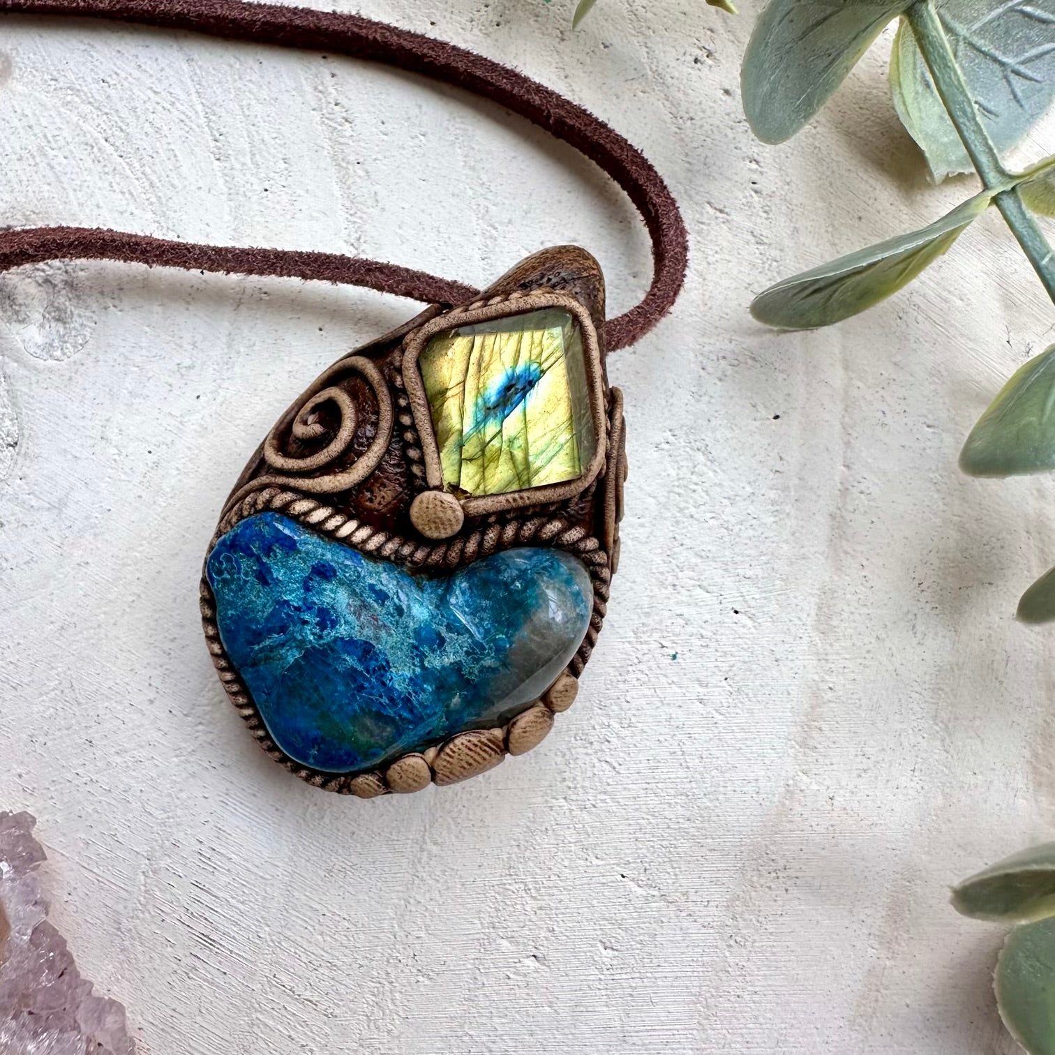 Close up of shattuckite and labradorite pendant