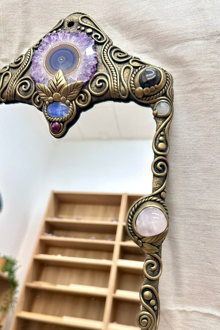 Unique crystal wall art mirror with natural gemstones for witchy decor, spiritual decor and sacred altar spaces.
