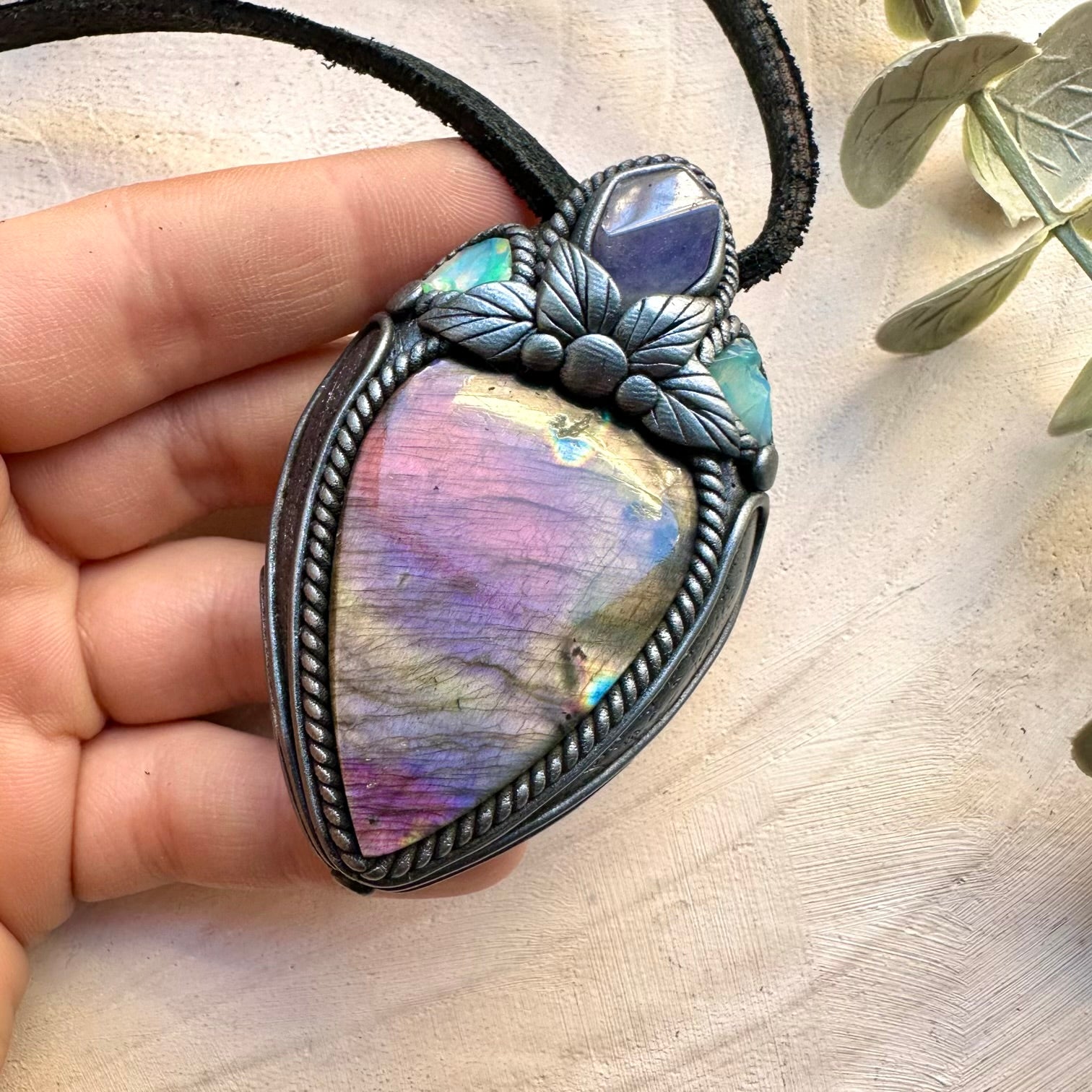 Handmade necklace featuring labradorite tanzanite and raw Ethiopian opal