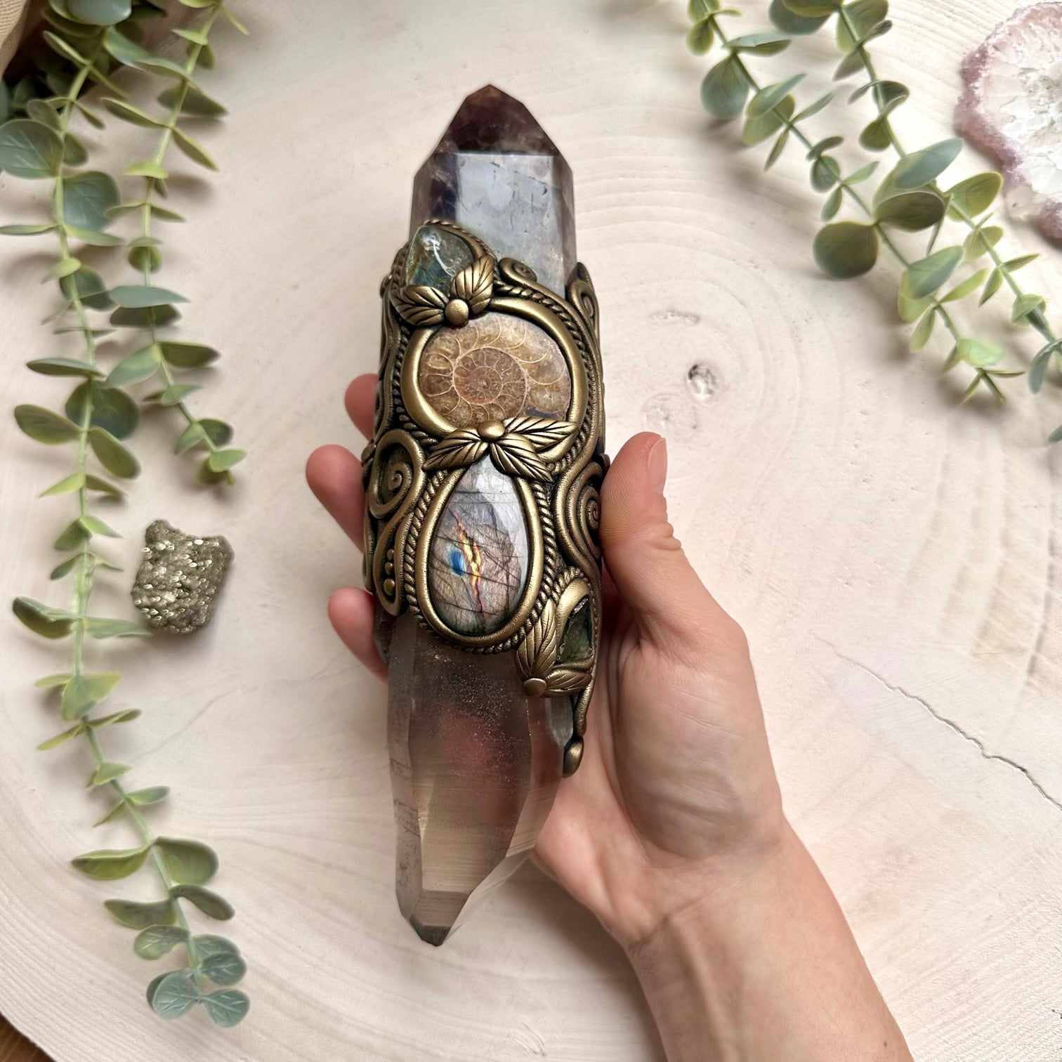 Lemurian quartz wand paired with moldavite and labradorite