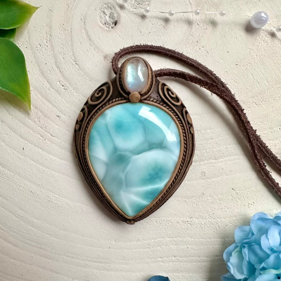 Handcrafted necklace featuring natural Larimar and Rainbow Moonstone