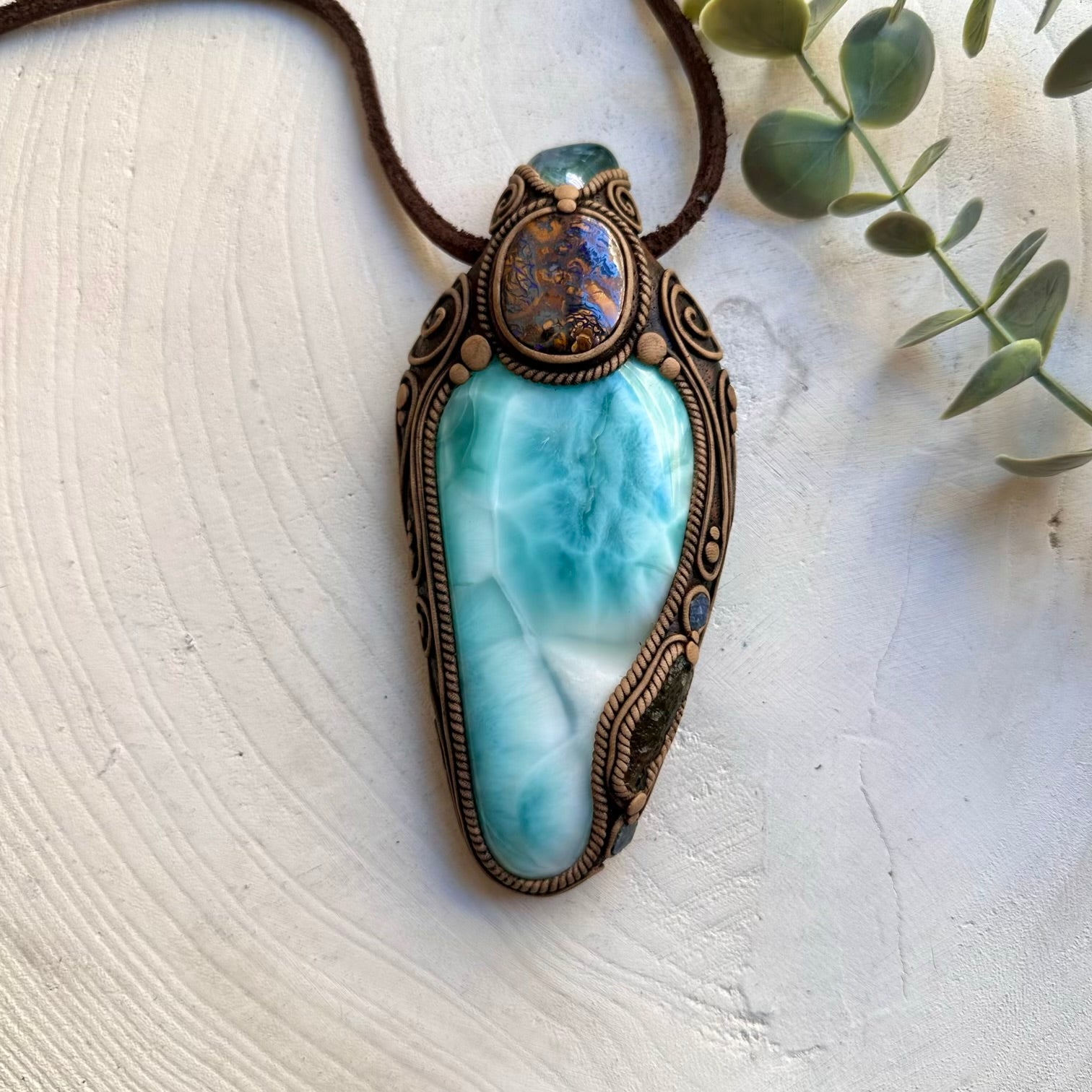 Handmade crystal talisman featuring Larimar, Moldavite and raw Blue Sapphire