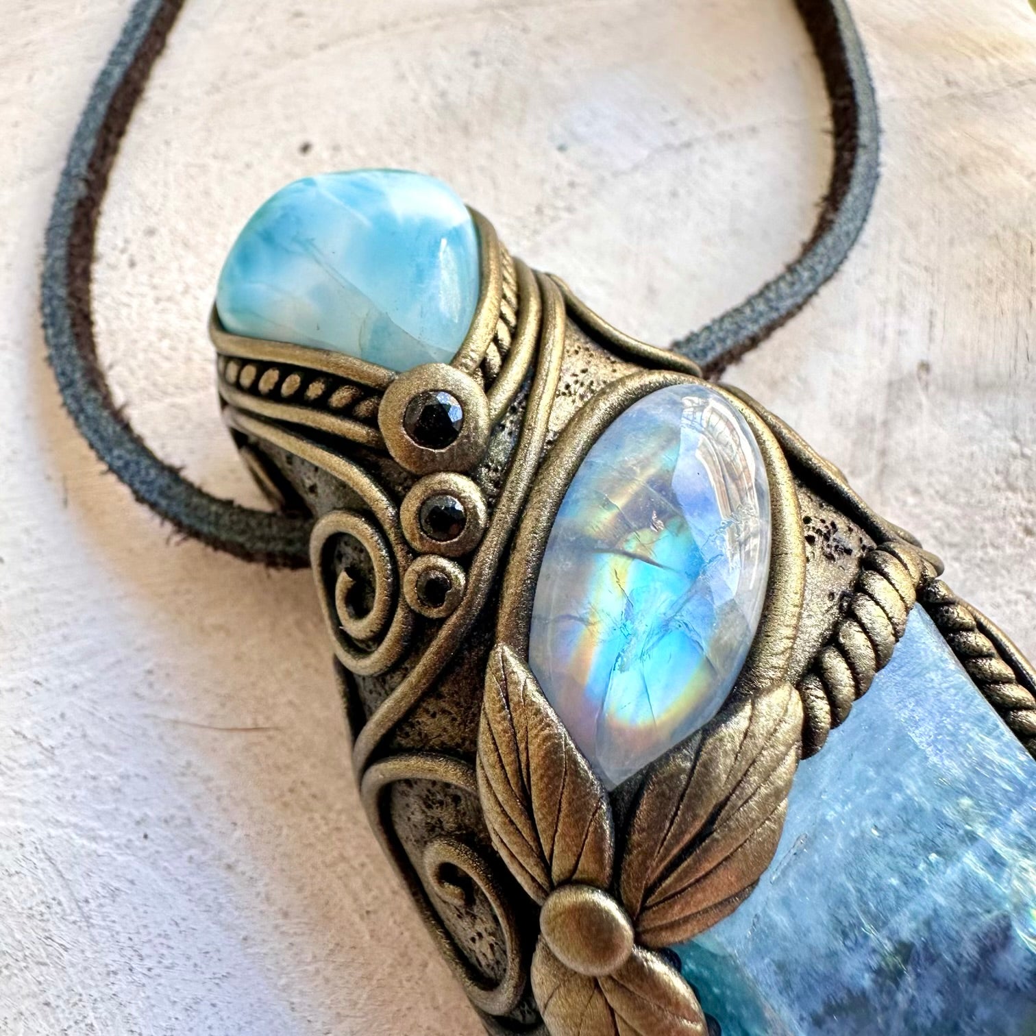 Spiritual crystal talisman handcrafted with Aqua Aura Quartz, Larimar and Rainbow Moonstone.