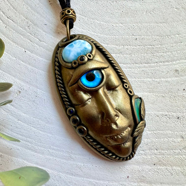 Artisan pendant necklace showcasing Larimar, Raw Ethiopian Opal and deep blue Sapphire gemstones.