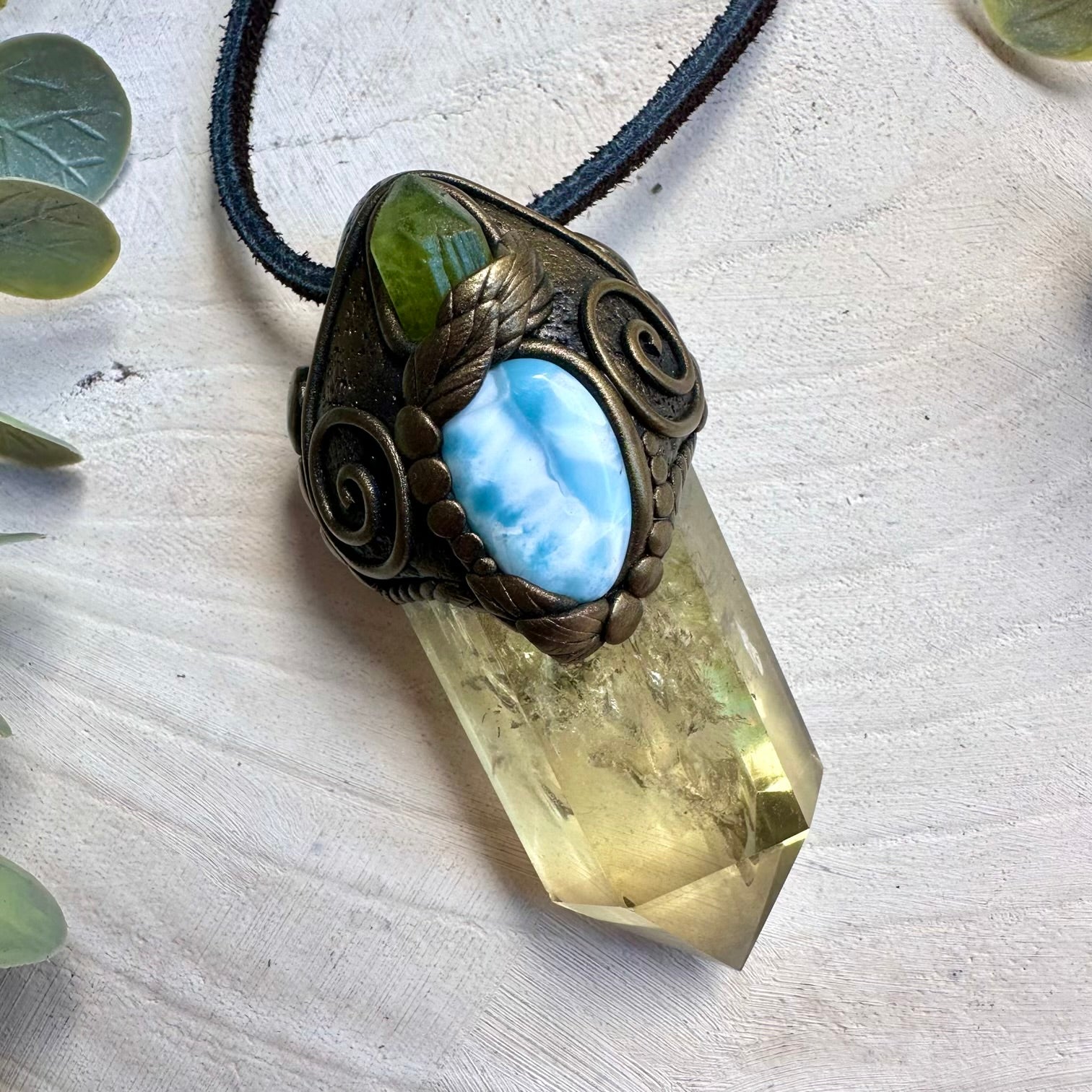 Citrine paired with raw peridot and larimar in a wand pendant