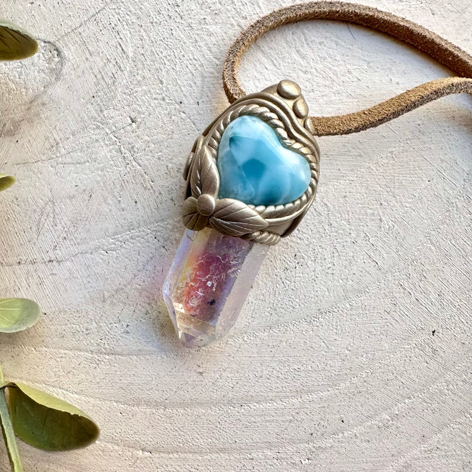 Spiritual jewelry combining aura quartz and larimar heart