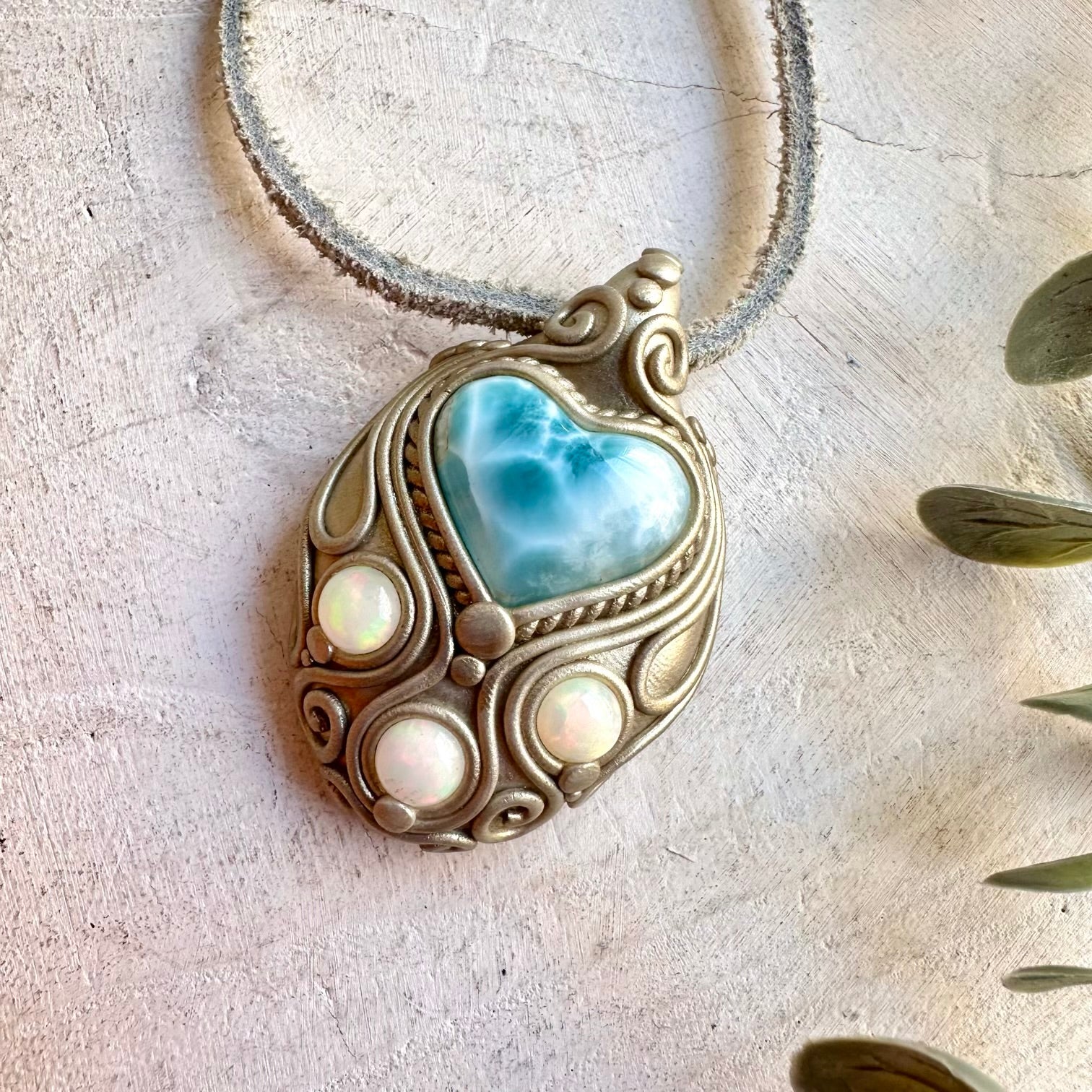 Handmade Larimar Heart necklace featuring a natural Ethiopian Opal gemstone.