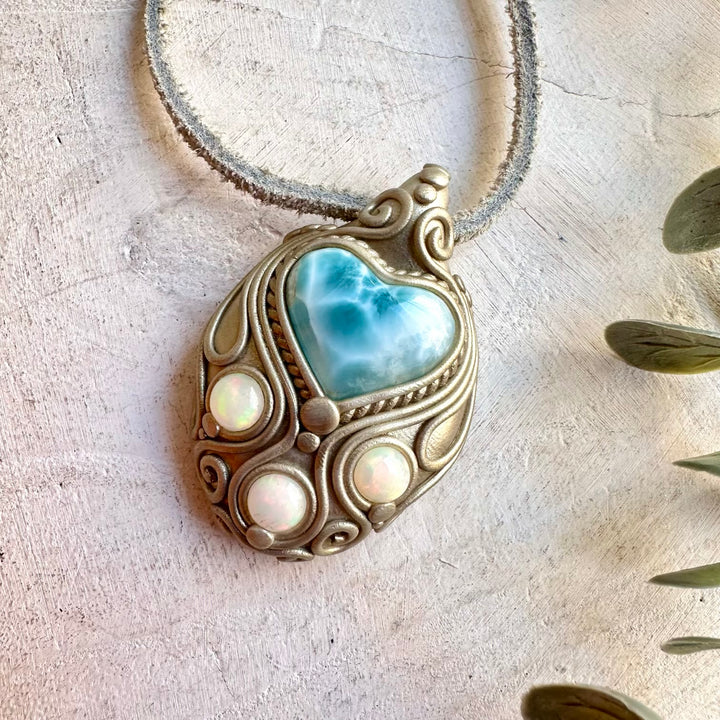 Handmade Larimar Heart necklace featuring a natural Ethiopian Opal gemstone.