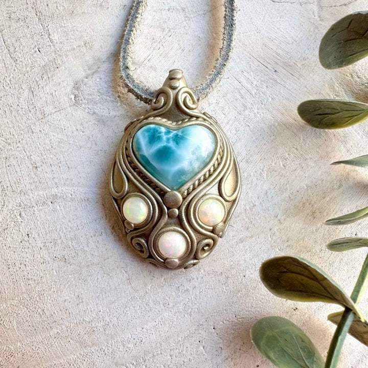 One of a kind pendant necklace with a Larimar Heart and vibrant Ethiopian Opal.