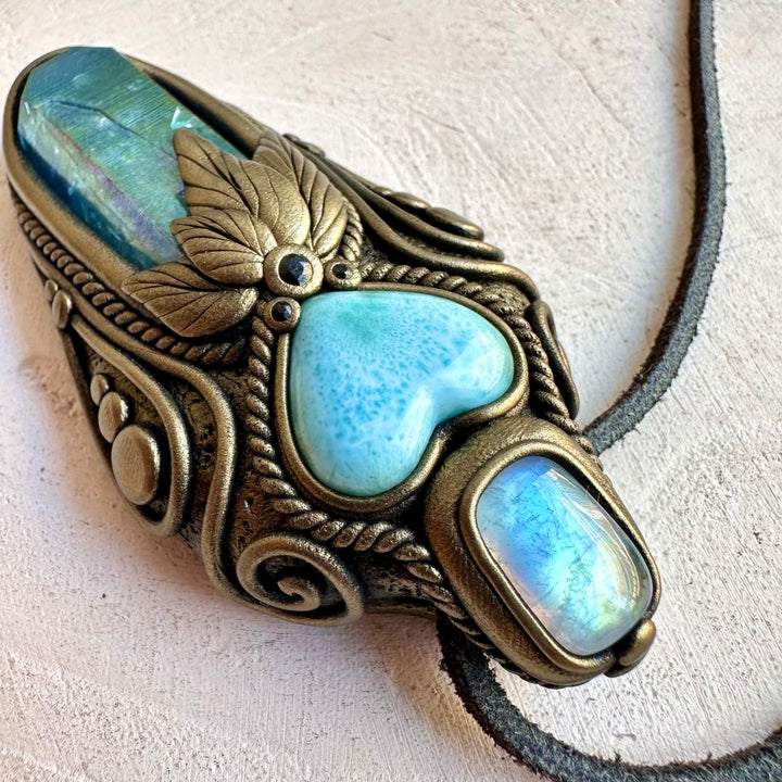 Handmade healing crystal pendant combining Larimar, Rainbow Moonstone and Blue Sapphire.