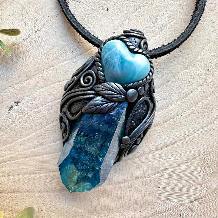 Spiritual jewelry combining aura quartz and larimar heart