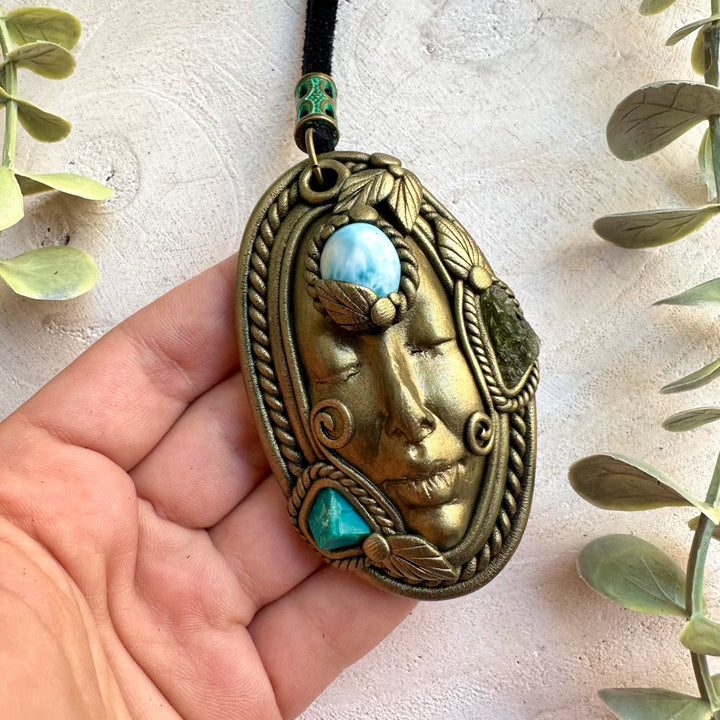 Natural gemstone goddess pendant necklace featuring a raw Chrysocolla crystal with Larimar and Moldavite.