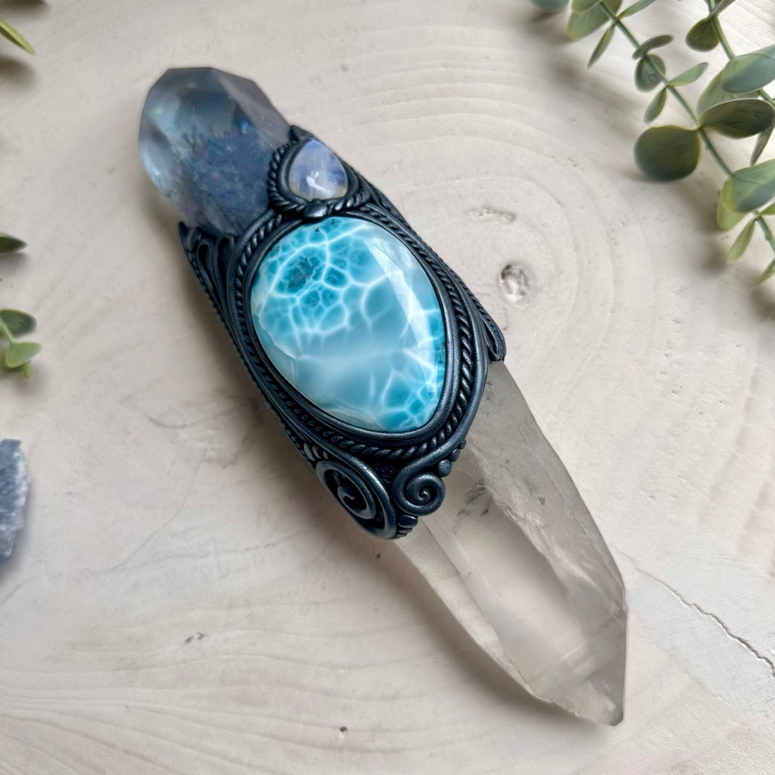 Spiritual healing wand combining aura quartz moonstone and larimar