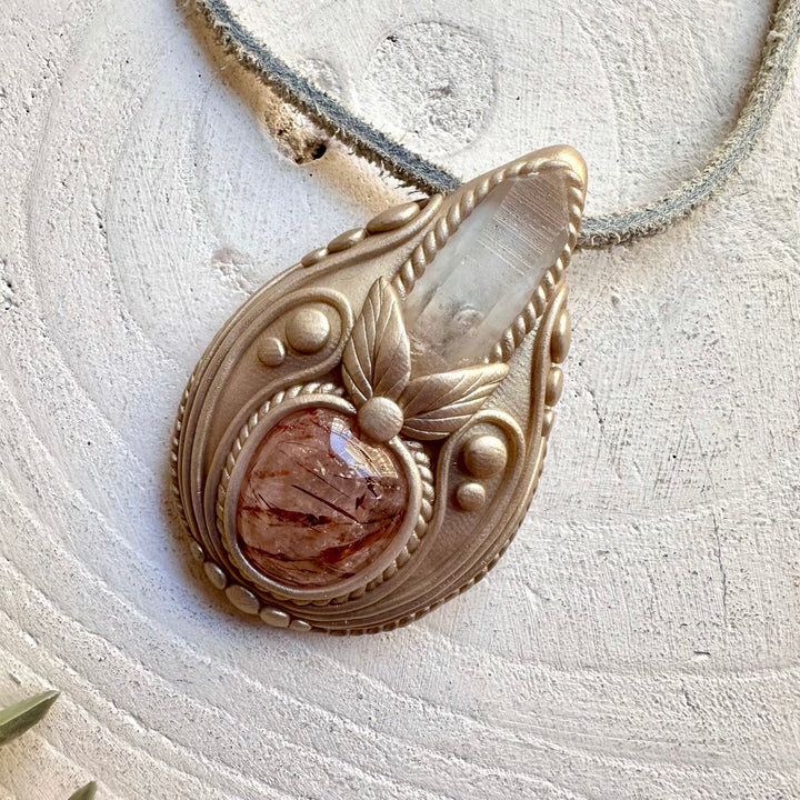 protection amulet crystal necklace with natural lemurian seed quartz point and polished hematite quartz