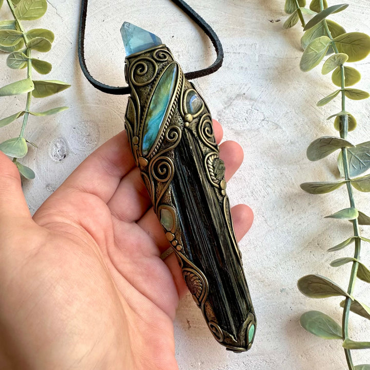 Handmade healing crystal wand necklace featuring Long Raw Black Tourmaline, Aqua Aura Quartz, Labradorite, Ethiopian Opal, Clear Topaz and Moldavite.