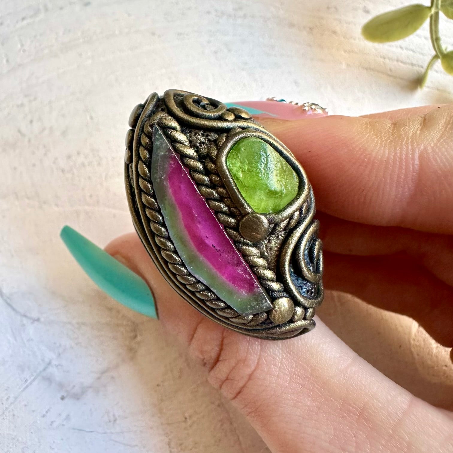Watermelon tourmaline paired with peridot in a ring