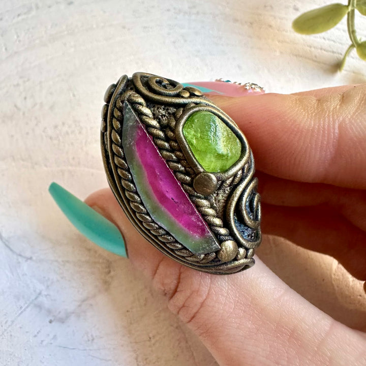 Watermelon tourmaline paired with peridot in a ring