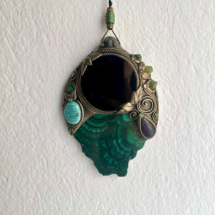Unique crystal home decor featuring vivid Malachite surrounding a Black Obsidian mirror with natural gemstone accents.
