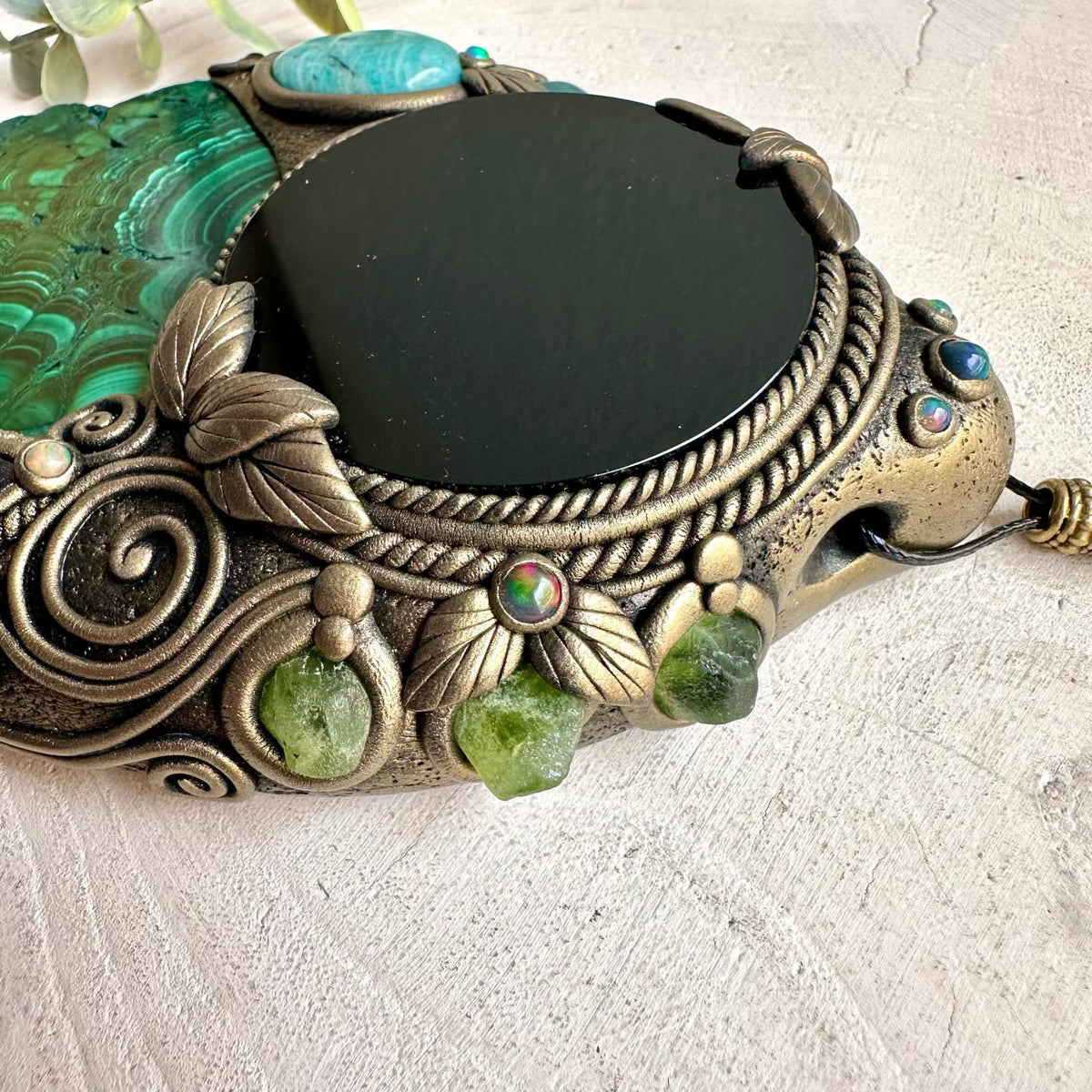 Handmade Natural Malachite wall hanging with Black Obsidian mirror, Amazonite, Amethyst, Peridot and Black Ethiopian Opal, created as unique spiritual crystal home decor.