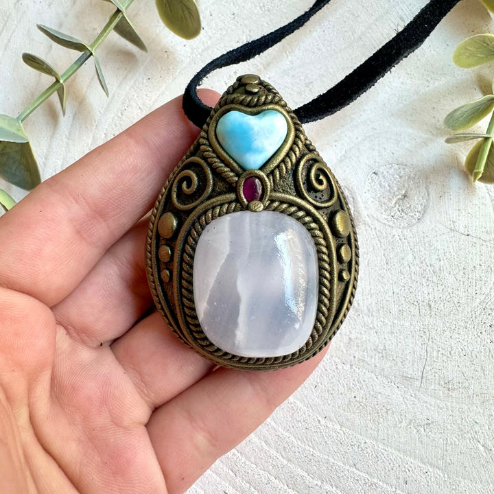 Handmade gemstone pendant combining Mango Calcite with Larimar and Rhodolite Garnet accents.
