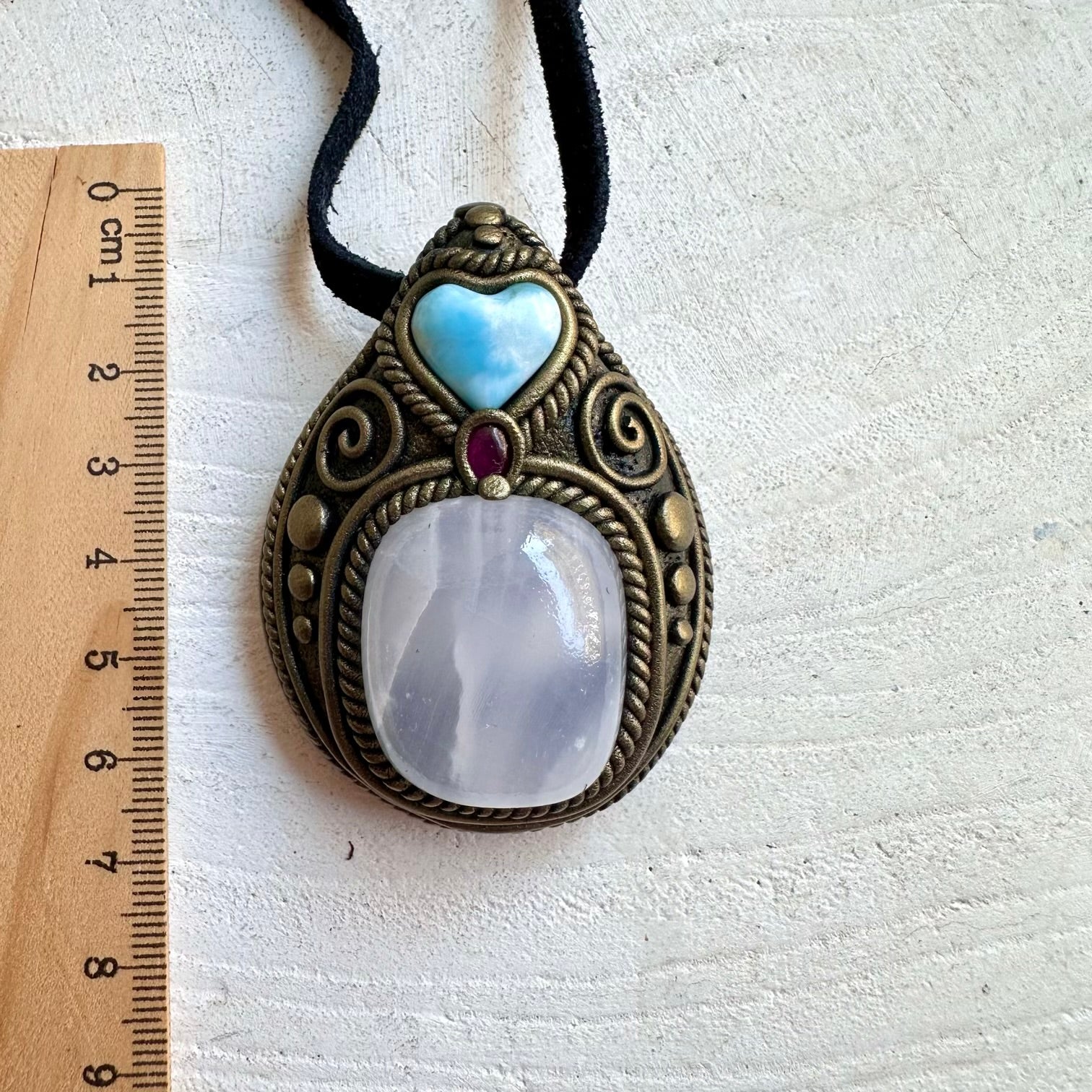 Handmade necklace featuring Mango Calcite, a Larimar Heart and Rhodolite Garnet.