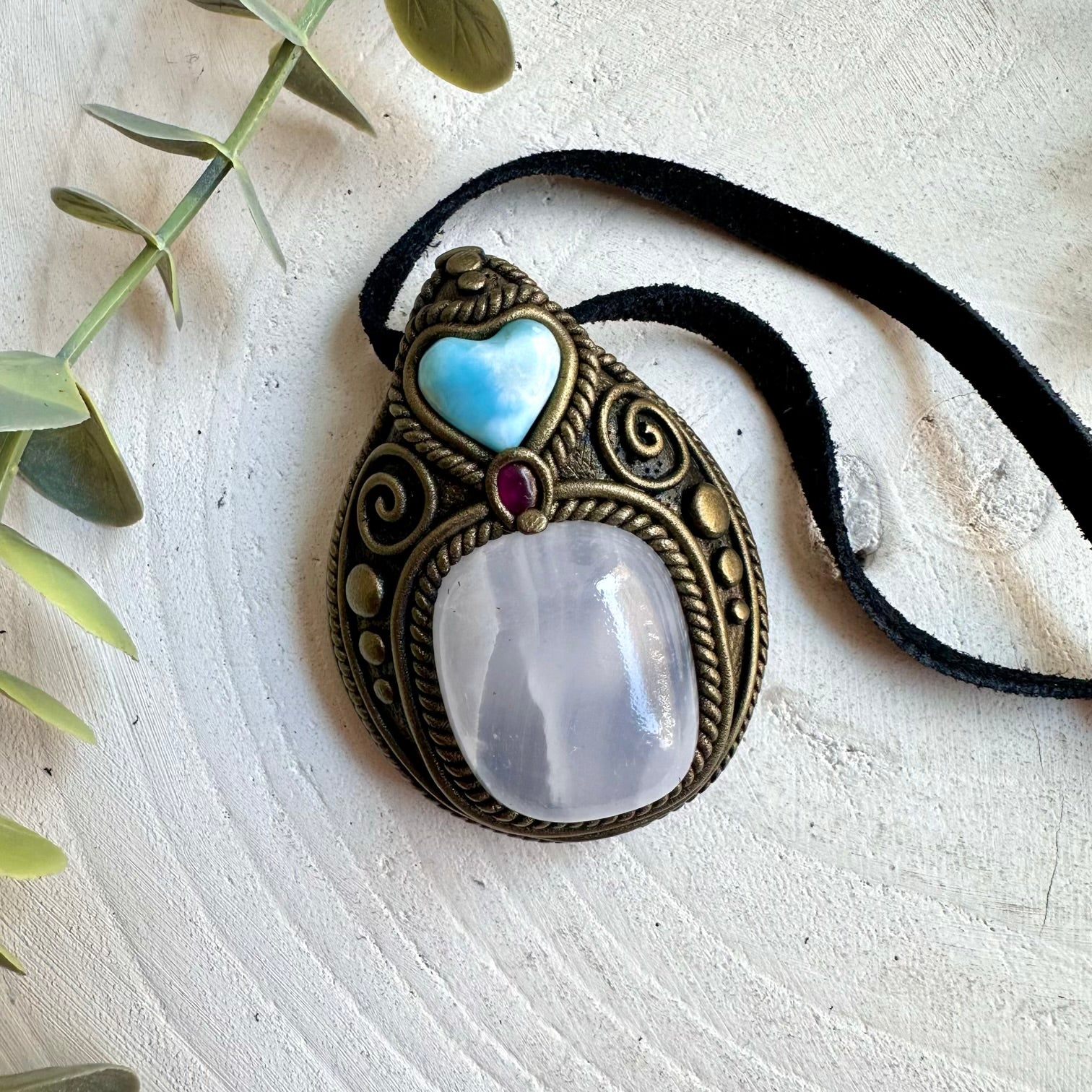 One of a kind pendant necklace featuring Mango Calcite and natural Larimar and Rhodolite Garnet.