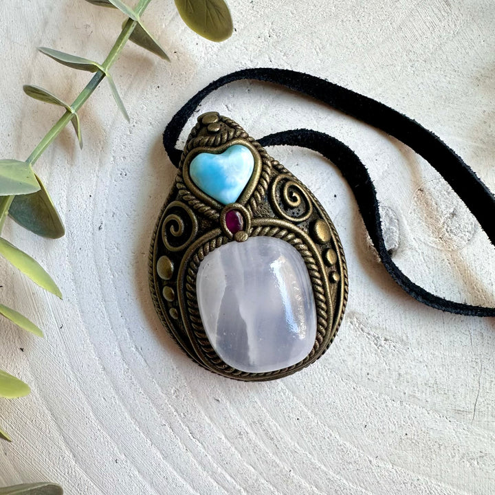 One of a kind pendant necklace featuring Mango Calcite and natural Larimar and Rhodolite Garnet.