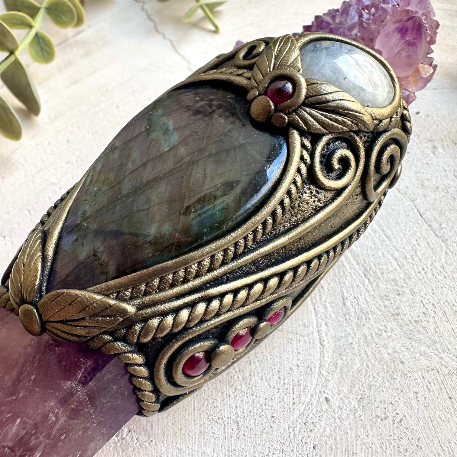Spiritual energy tool featuring a polished Ametrine point with Moonstone, Amethyst and Rhodolite Garnet.