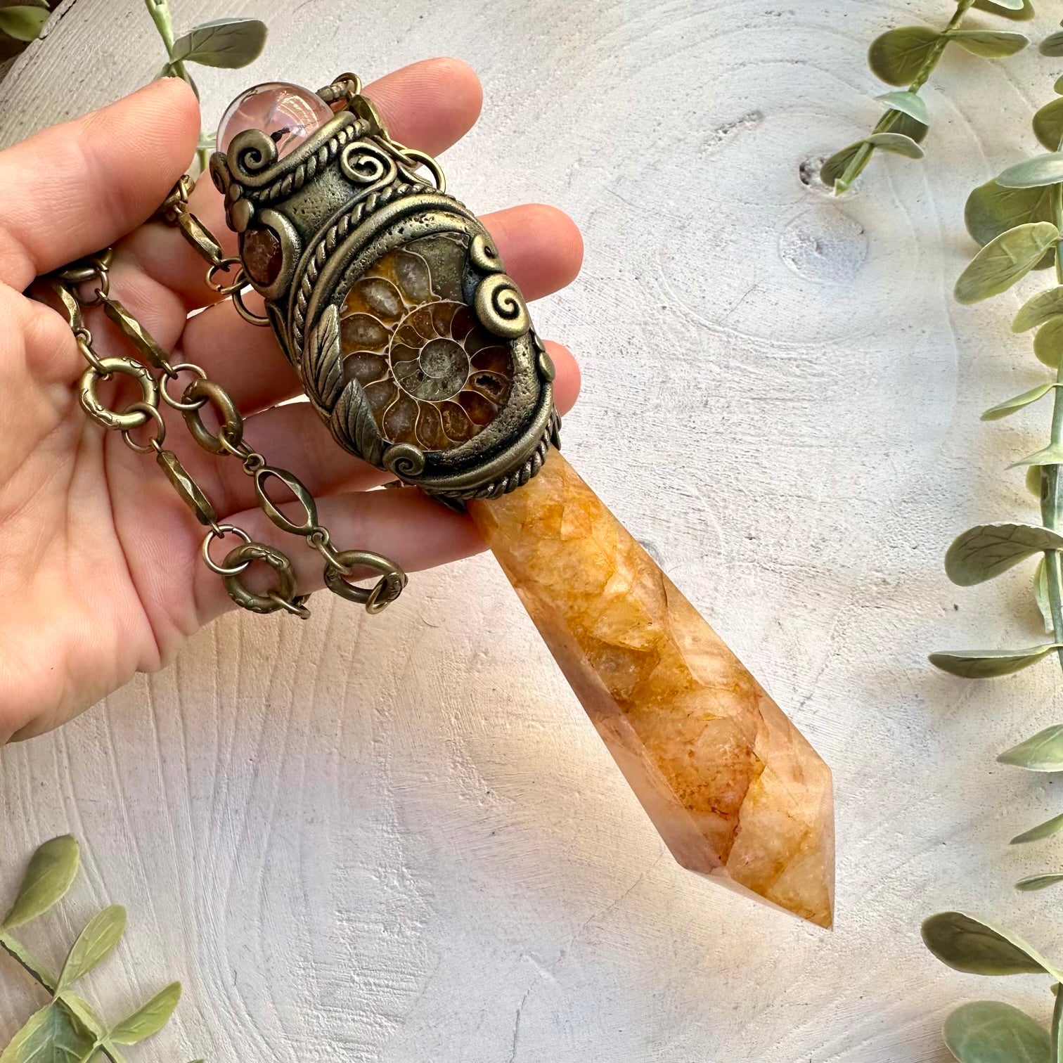 Crystal wand combining ancient ammonite and golden healer