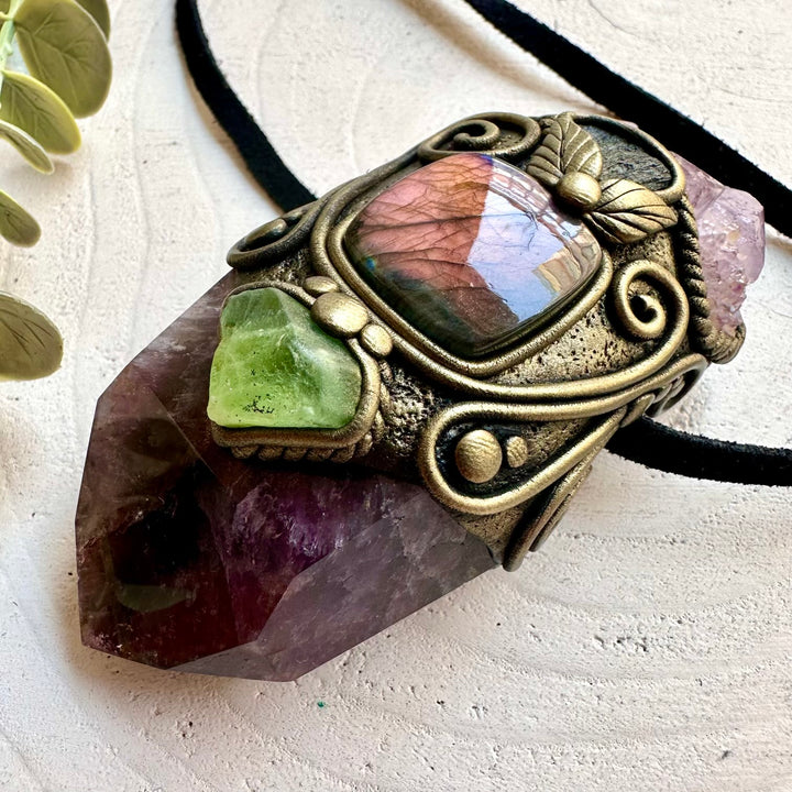Crystal healing necklace designed with Super Seven Quartz and genuine natural crystals for meditation and rituals.