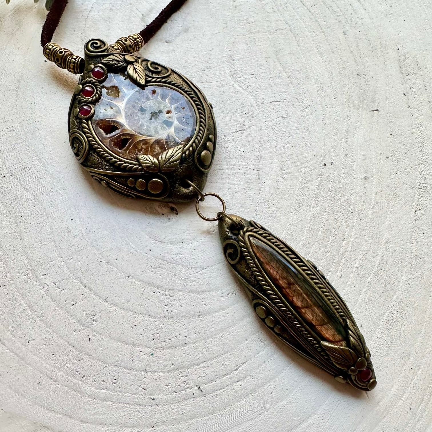 Handmade healing crystal necklace with Ammonite, Labradorite and Rhodolite Garnet in an artisan design.