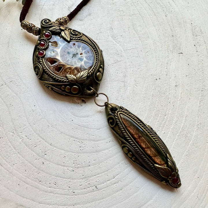 Handmade healing crystal necklace with Ammonite, Labradorite and Rhodolite Garnet in an artisan design.