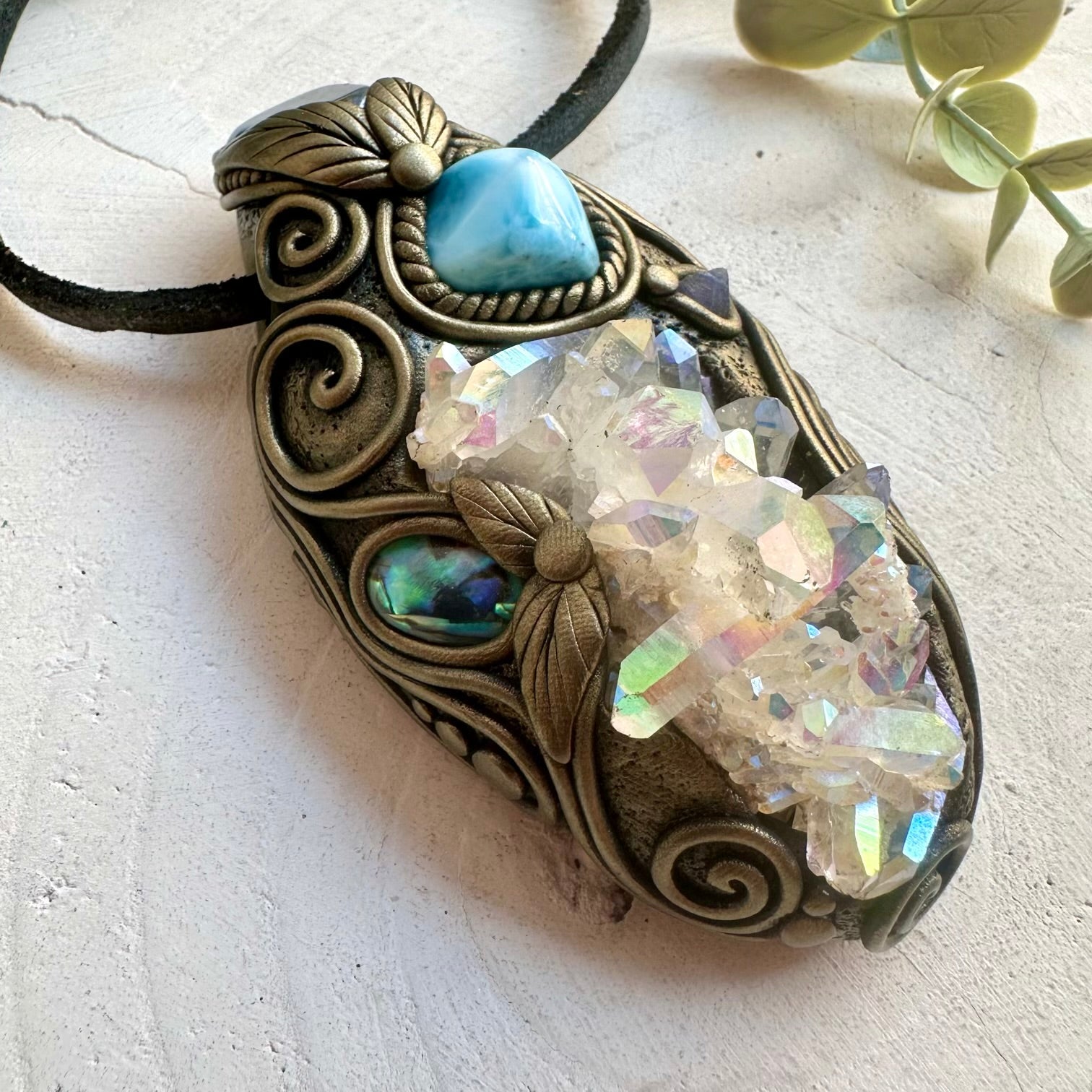 Handmade crystal pendant combining Angel Aura Quartz, Aqua Aura Quartz and ocean-inspired Larimar.