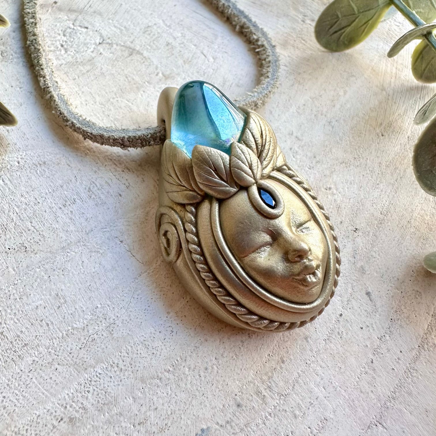 Handmade gemstone necklace combining shimmering Aqua Aura Quartz with natural Blue Sapphire.