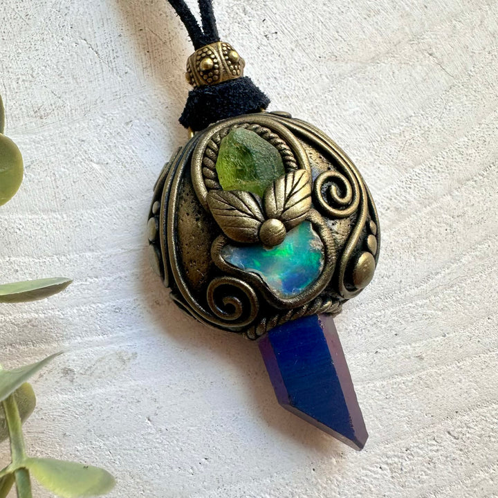 Natural gemstone jewelry showcasing shimmering Cobalt Aura Quartz and a unique Raw Ethiopian Opal.
