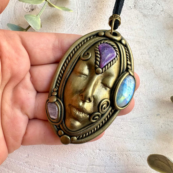 One of a kind crystal Goddess pendant with iridescent Rainbow Moonstone, purple Charoite and soft pink Kunzite.