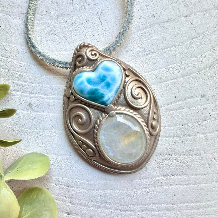 Metaphysical crystal jewelry handmade with larimar heart and rainbow moonstone