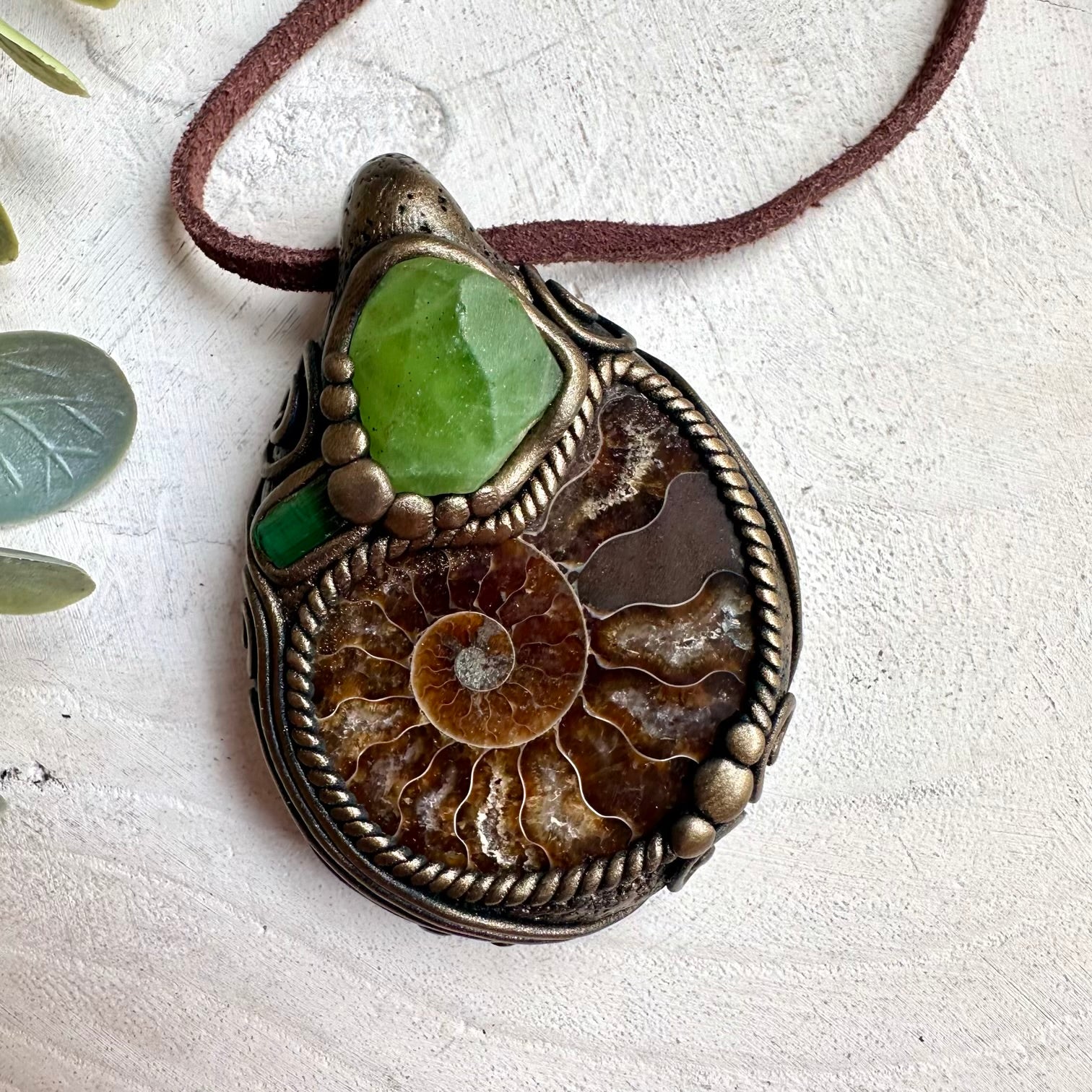 Metaphysical healing gemstone necklace with ammonite fossil, peridot, and green tourmaline