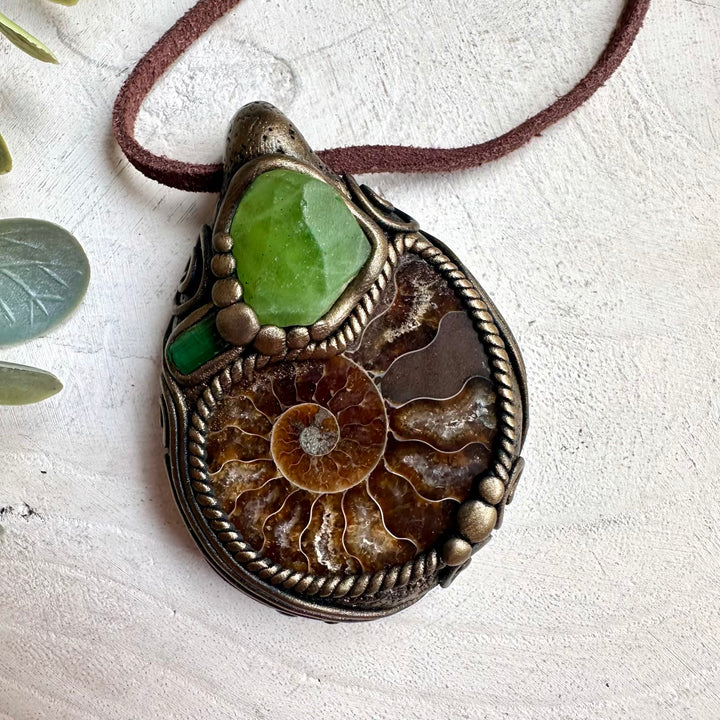 Metaphysical healing gemstone necklace with ammonite fossil, peridot, and green tourmaline