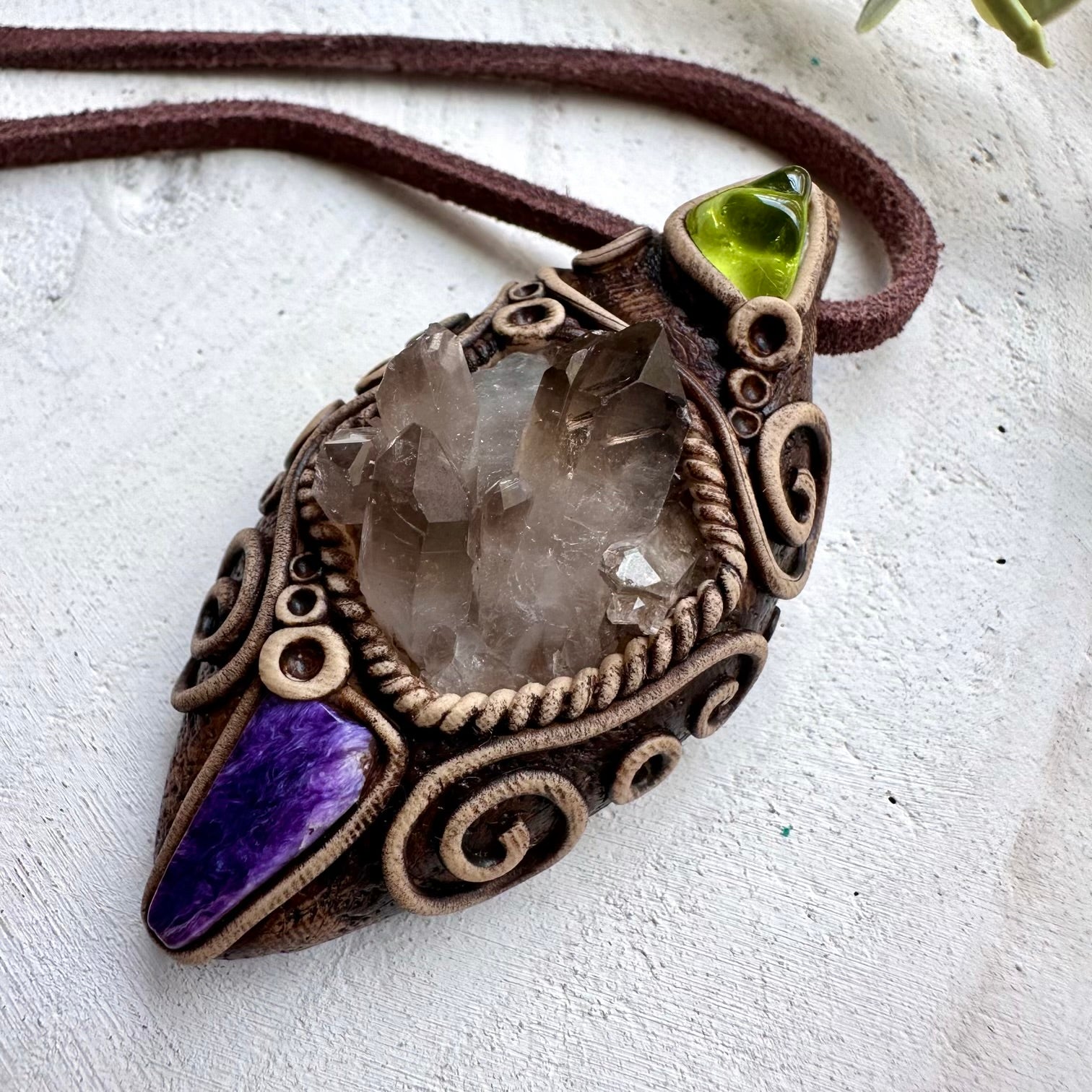 Smoky quartz paired with charoite and peridot in a unisex pendant necklace