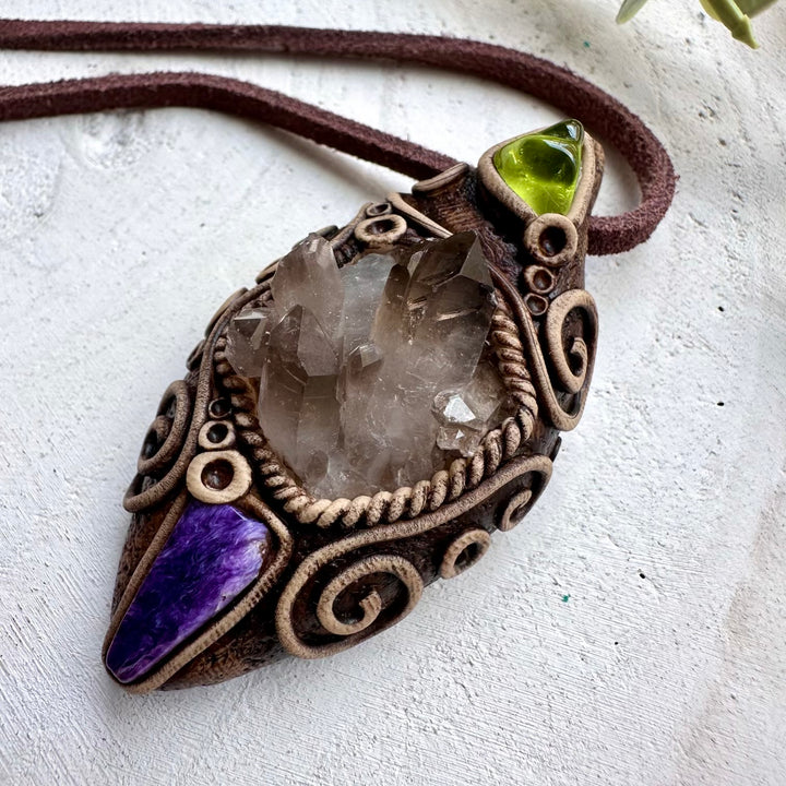Smoky quartz paired with charoite and peridot in a unisex pendant necklace