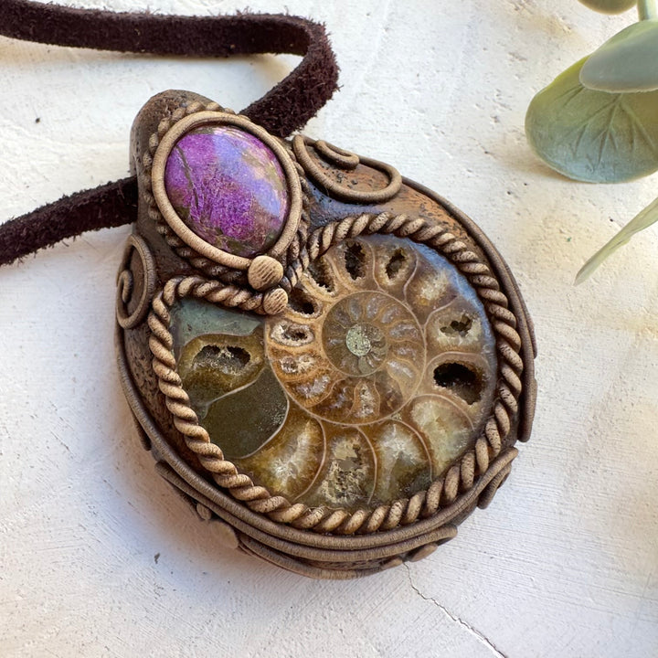 Fossil jewelry pendant with natural ammonite and stichtite crystal