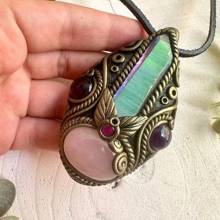 Handmade Rose Quartz pendant necklace featuring an Angel Aura Quartz Point, Amethyst and Rhodolite Garnet, a one of a kind crystal talisman designed for self-love, emotional healing, spiritual connection and heart-centered energy.