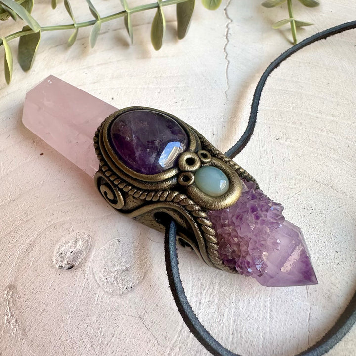 Spiritual crystal pendant featuring Rose Quartz with soothing Chalcedony and Amethyst accents.